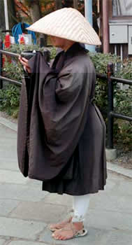 Monk begging for alms in Kyoto